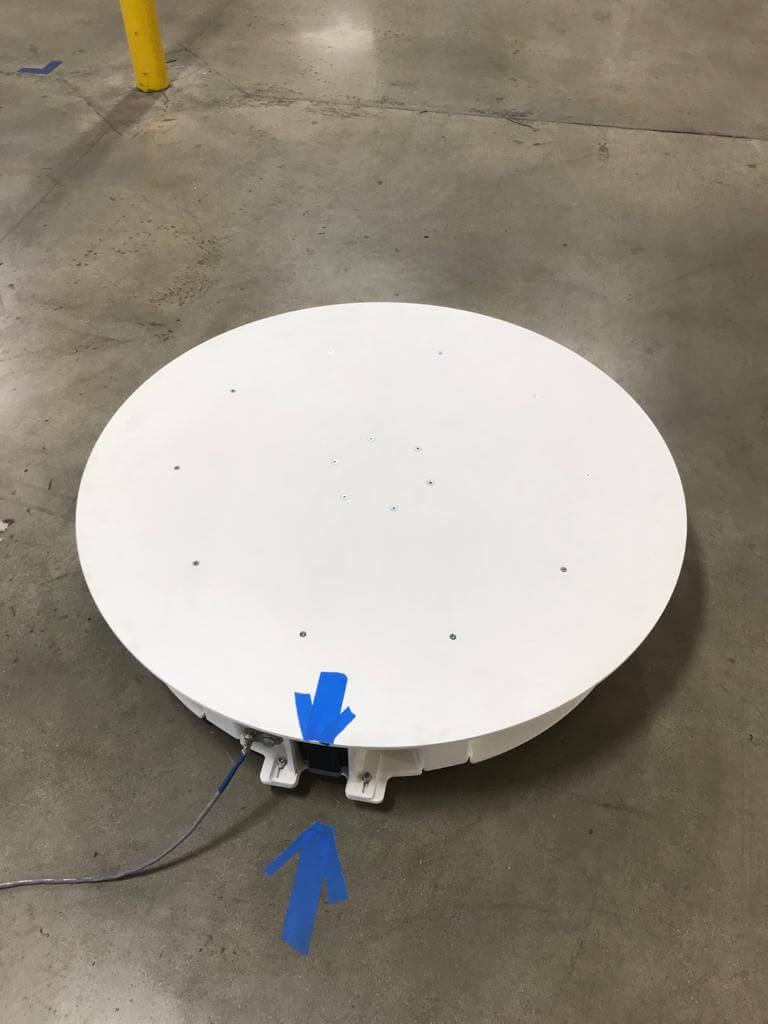 Platinum XXL turntable shown in a warehouse setting for 360 product photography.
